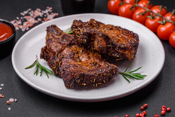 Delicious beef or pork steak on the bone grilled with spices and rosemary