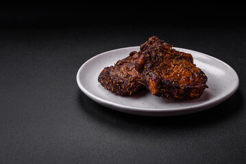 Delicious beef or pork steak on the bone grilled with spices and rosemary