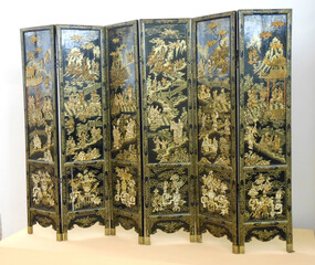 Ancient chinese screen with golden details on a black background