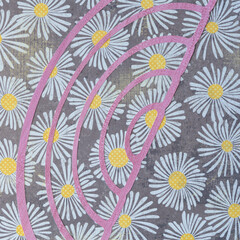 cut paper shape (c or bracket) on scrapbook paper with floral pattern