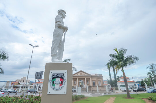 Vinhedo-sp,brazil-April 27,2023 immigrant museum in the background with sculpture representing the immigrant in front,statue symbol of the city of vinhedo sp