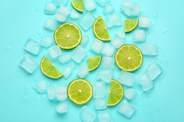 Sliced fresh lime and ice cubes on turquoise background