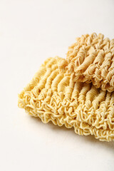 Raw instant noodles on white grunge background