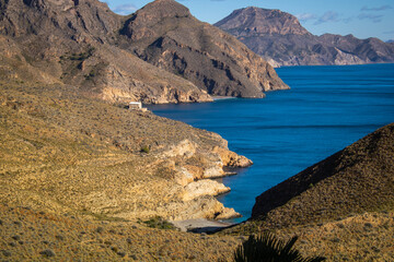 Fototapeta na wymiar View of the rugged coastline of Cartagena, Spain, with the mountains reaching the sea and the wild coves in the background in broad daylight