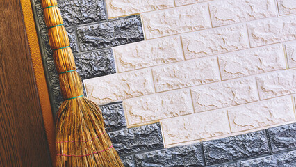 Reed broom for sweeping and cleaning near the wall with plastic profiles