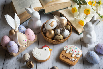 A cup of hot coffee on a festive Easter table with colored eggs.