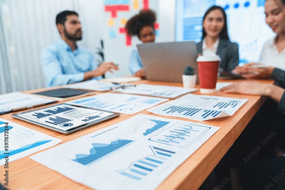 Poster focus financial dashboard paper showing graphs and chart with blurred background of diverse business