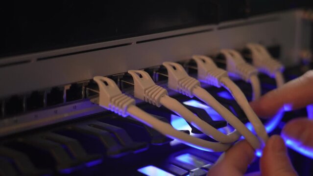 IT expert working with computer server network cable. Connectivity, Internet, technician, installing.