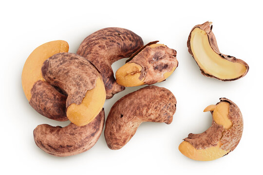 cashew nuts heap with shell isolated on white background. Top view. Flat lay