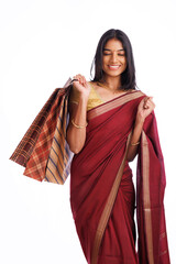 Exited Beautiful Indian traditional woman holding shopping bags