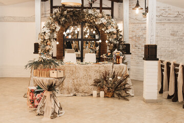 The table is decorated with dried flowers for the event, autumn wedding decor