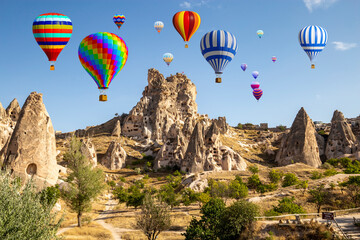Hot air balloon flying over spectacular Cappadocia, Uchisar - Goreme, Turkey