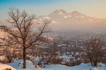 Erciyes Mount with from Kayseri. Height of 3,864 metres is the highest mountain in Cappadocia and central Anatolia. It is a volcano. Hacilar city - obrazy, fototapety, plakaty