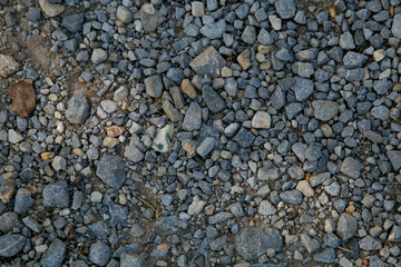 Texture or background of small stones at sunset
