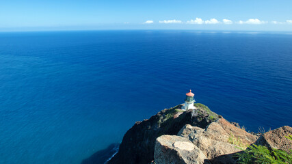 Fototapeta na wymiar Makapuu Lighthouse on steep cliff side on Oahu Hawaii United States