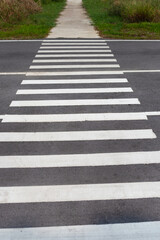 White crosswalk lines on road