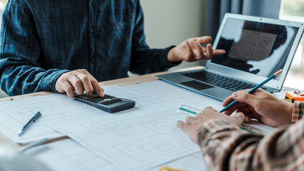Civil engineer teams meeting house rebuilding foundation construction planning and blueprints at...