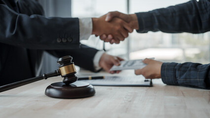 Shaking hands, Lawyer accepting bribe concept for signing legal contract approval, rights of liberty, bribery, Concept of law, justice, court trial, and professional legal services, judge