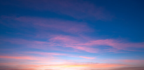 Naklejka na ściany i meble Beautiful Romantic Orange Sunset Clouds with sunlight on Dusk Sky Twilight background in Panoramic view