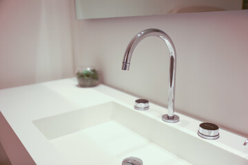 sink faucet with water is a symbol of life, purity, and renewal. It represents the essential element of water as a source of nourishment, refreshment, and cleansing