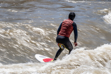 Surfing River Waves