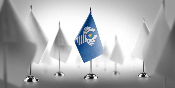 The national flag of the CIS surrounded by white flags