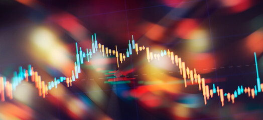 Fototapeta na wymiar Concept of stock market and fintech. Blurry digital charts over dark blue background.