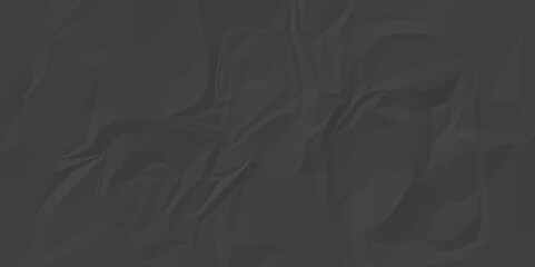 Black crumpled paper texture background. Creative background with scattered overlay of crumpled black paper. A crumpled sheet of black paper abstract background.
