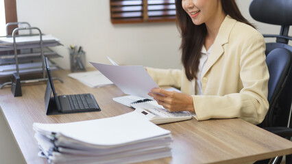 Work of secretary concept, Female secretary thoughtful while reading data on business document