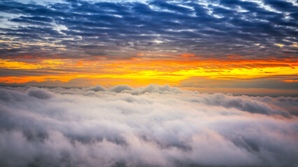 Fototapeta na wymiar dramatic aerial view landscape blue morning sky with sea of mist and clouds at sunrise