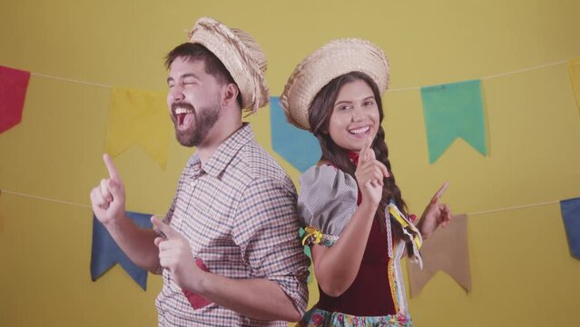 Brazilian couple, dressed in Junina party clothes, S&atilde;o Jo&atilde;o party. Protocol scenes.