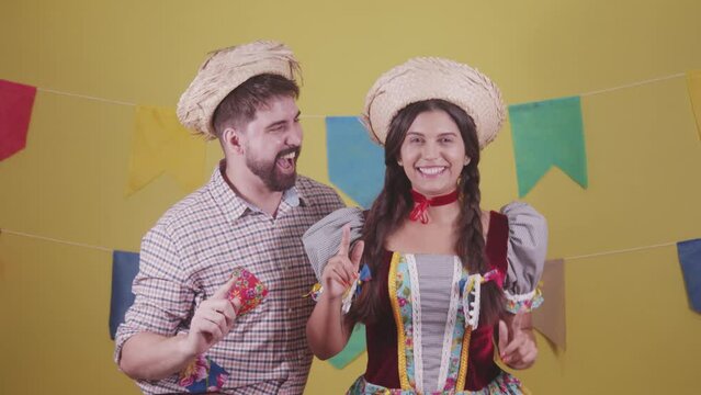 Brazilian couple, dressed in Junina party clothes, S&atilde;o Jo&atilde;o party. Protocol scenes.