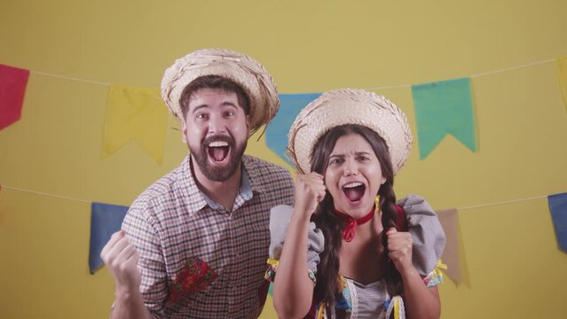 Brazilian couple, dressed in Junina party clothes, S&atilde;o Jo&atilde;o party. Protocol scenes.