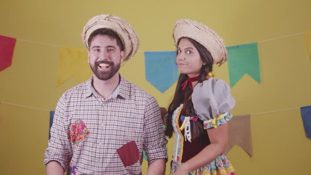 Brazilian couple, dressed in Junina party clothes, S&atilde;o Jo&atilde;o party. Protocol scenes.
