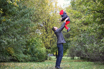 Fototapeta premium Young family with children on a walk