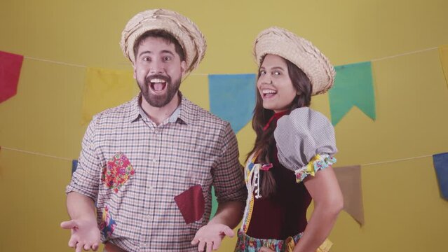 Brazilian couple, dressed in Junina party clothes, S&atilde;o Jo&atilde;o party. Protocol scenes.