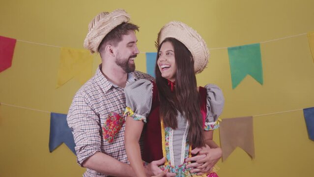Brazilian couple, dressed in Junina party clothes, S&atilde;o Jo&atilde;o party. Protocol scenes.