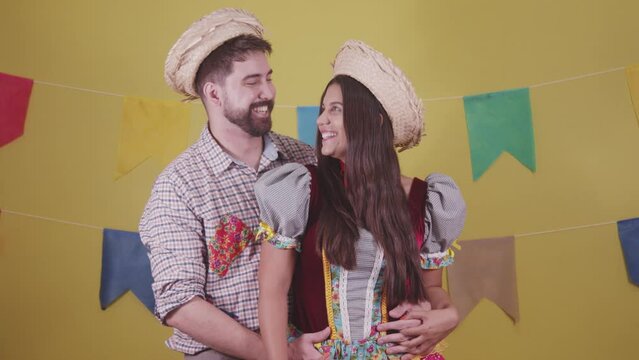 Brazilian couple, dressed in Junina party clothes, S&atilde;o Jo&atilde;o party. Protocol scenes.