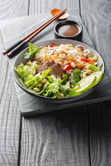 Pho tron or mixed pho is a classic Vietnamese dish a salad with meat beef, noodles and greens...