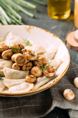 Portion of russian dumplings vareniki with mushroom filling