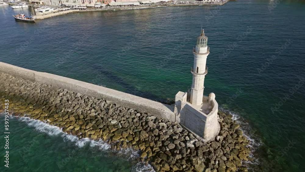 Canvas Prints Orbiting aerial camera of an old Venetian era lighthouse at Chania on Crete, Greece