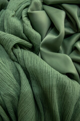 green ruffled fabric and crepe fabric