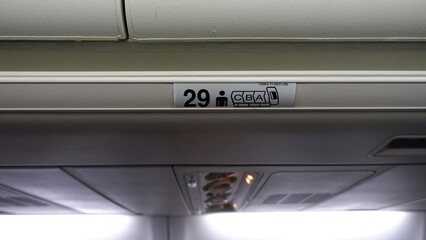 Sign indicating seating in the fuselage of an airliner.