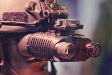 Army binoculars with night vision on a soldier's helmet. Optical device on a military helmet for tracking in war © Андрей Журавлев