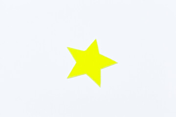 Yellow felt stars of different sizes on a white background. isolate