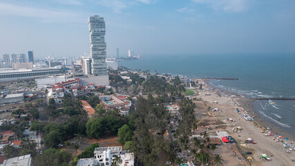 A breathtaking aerial view of Boca del Rio, Veracruz by the coast, featuring an impressive skyline with towering skyscrapers and built structures.