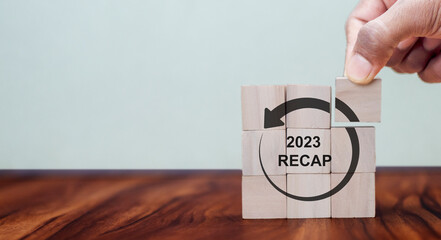 2023 Recap economy, business, financial concept. For business planning. RECAP word icon on wooden...