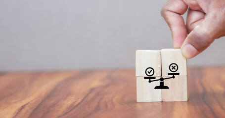 Business ethics concept. Business moral principles concept. Hand holds the wooden cubes with...