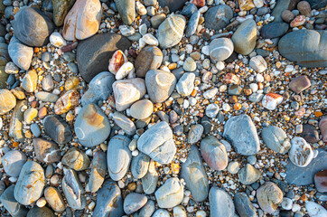 .amazing to see on the beach is full of round rocks instead of sand. .round rocks have beautiful color and various size. .rocks beach at the lighthouse landmark of Lanta island Krabi. stone background