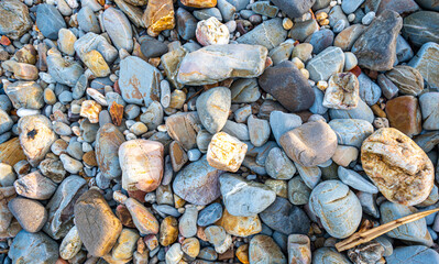 .amazing to see on the beach is full of round rocks instead of sand. .round rocks have beautiful color and various size. .rocks beach at the lighthouse landmark of Lanta island Krabi. stone 